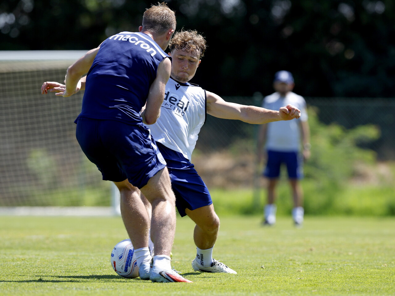 Callum Styles and Aune Heggebø challenging for the ball during training 