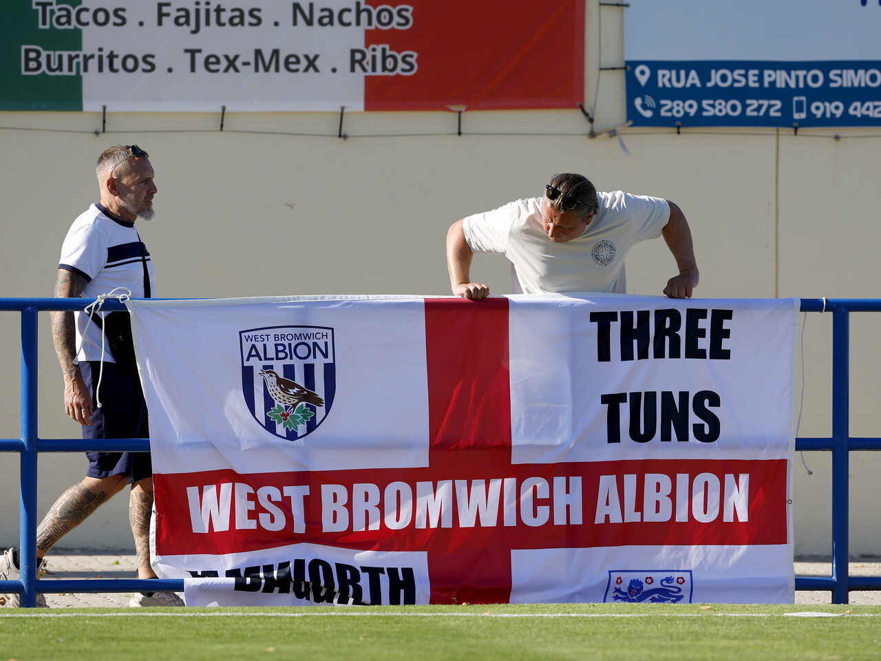 WBA fans putting up a WBA flag before the Bromley match