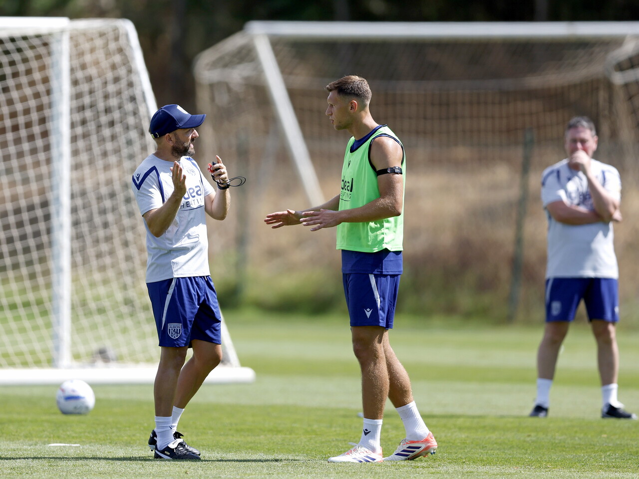 Krystian Bielik chatting with Gavin Strachan during a training session