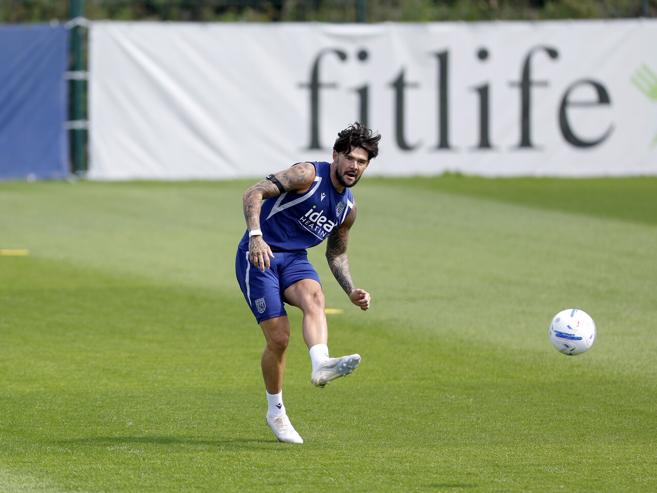 Alex Mowatt passing the ball during a training session