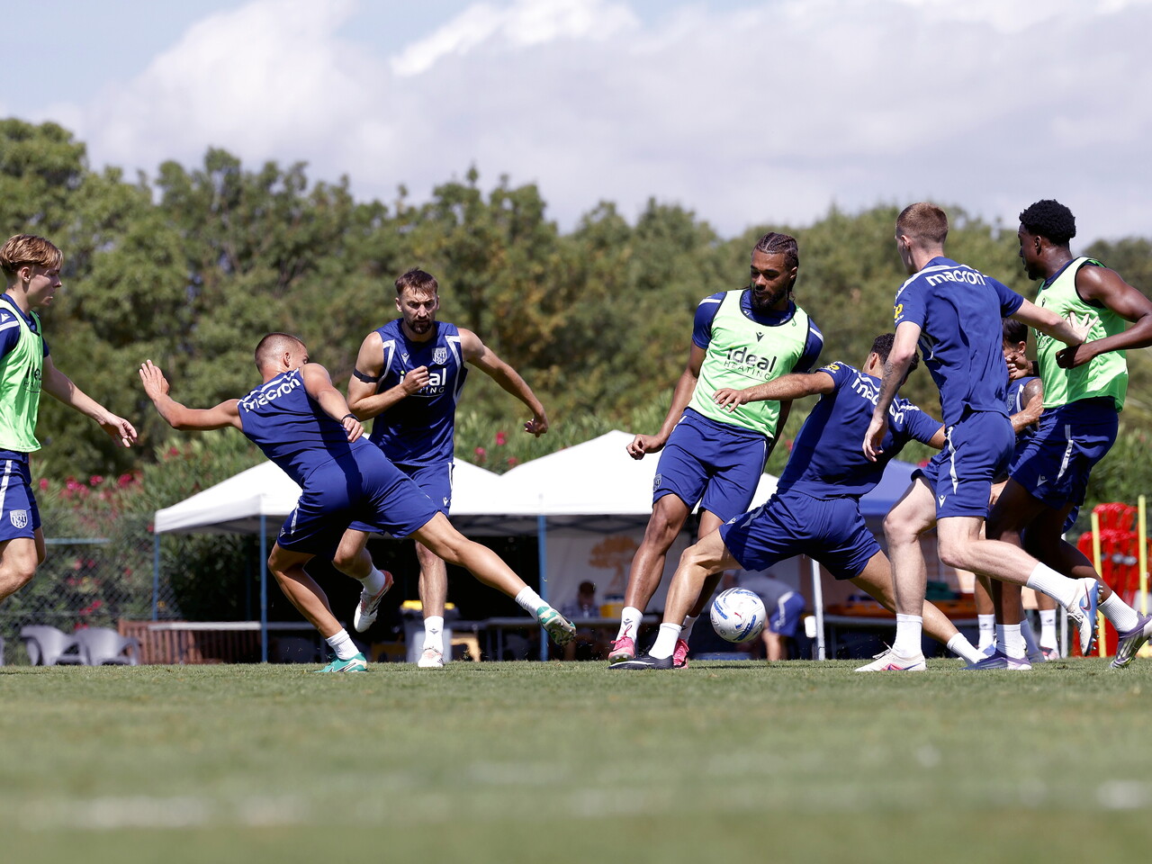 Several players battling for the ball during a training session