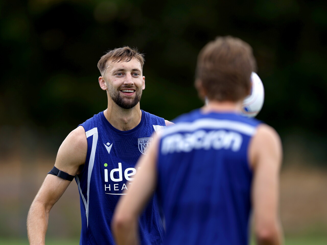 Nat Phillips smiles on the training pitch in Portugal