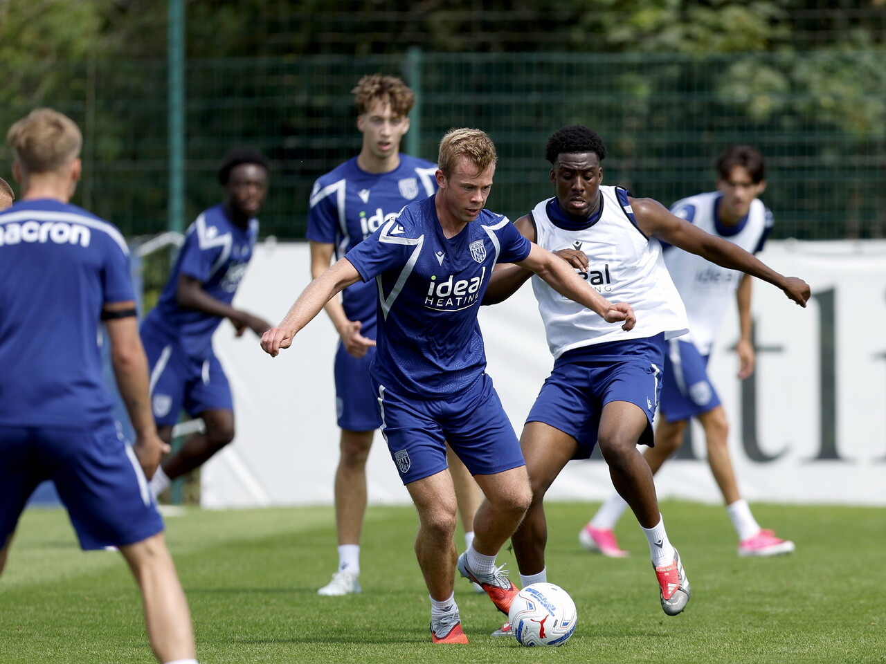 Aune Heggebø on the ball during a training session, closely followed by Souleyman Mandey