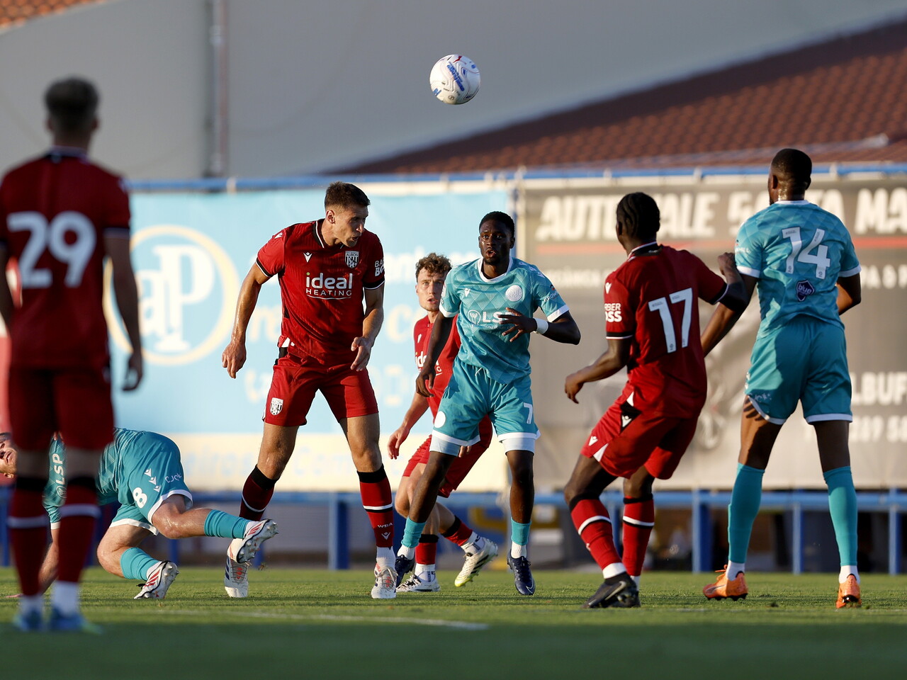 Krystian Bielik winning a header against Bromley