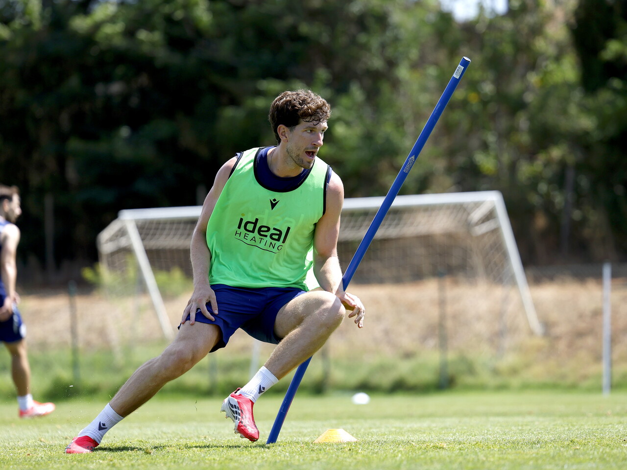 Chris Mepham running around a pole during a training session