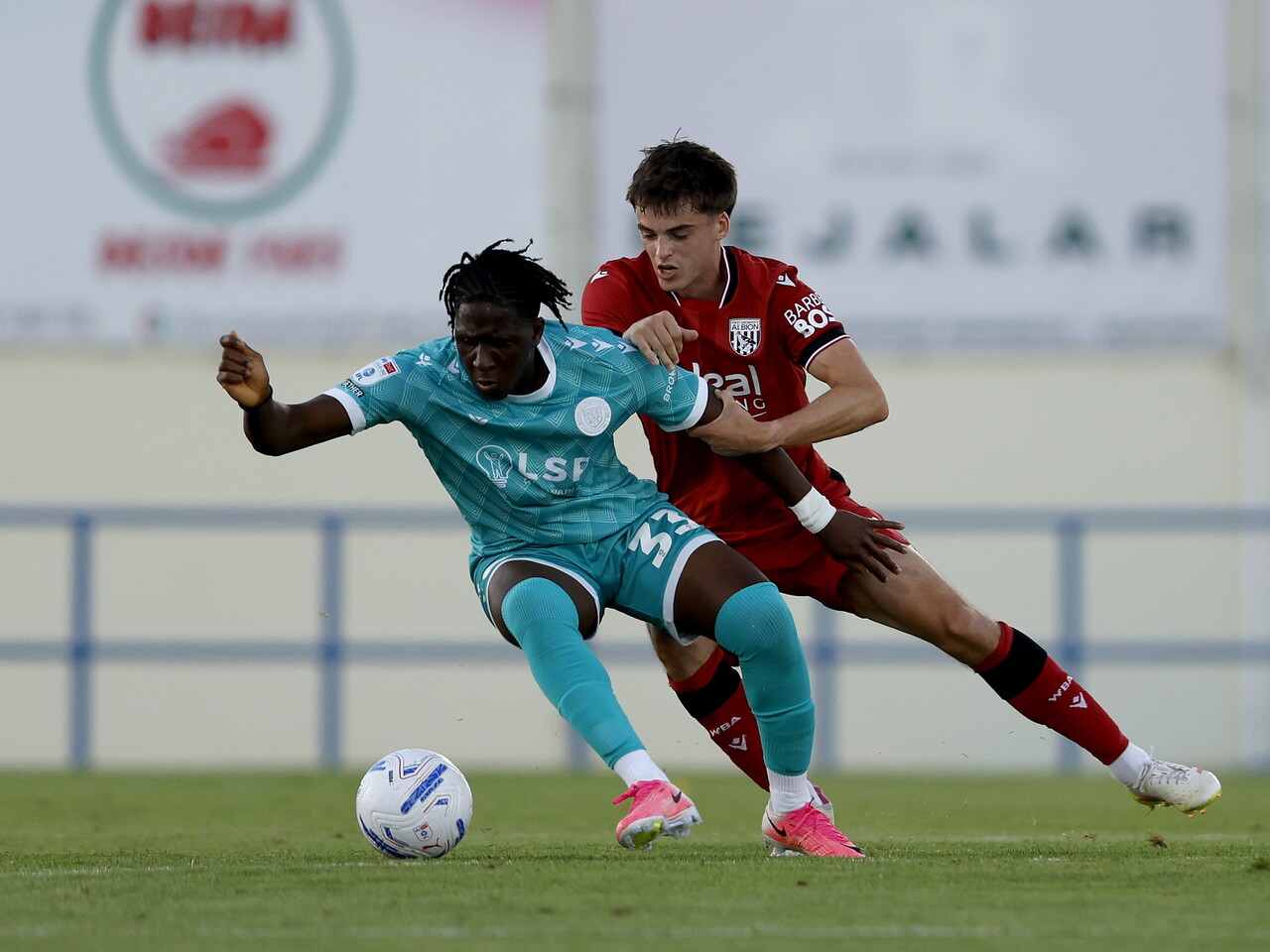 Alex Williams trying to tackle a Bromley player 