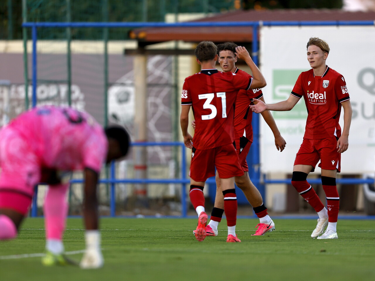 Barney Stewart celebrates scoring against Bromley with Ollie Bostock and Jack Bray 