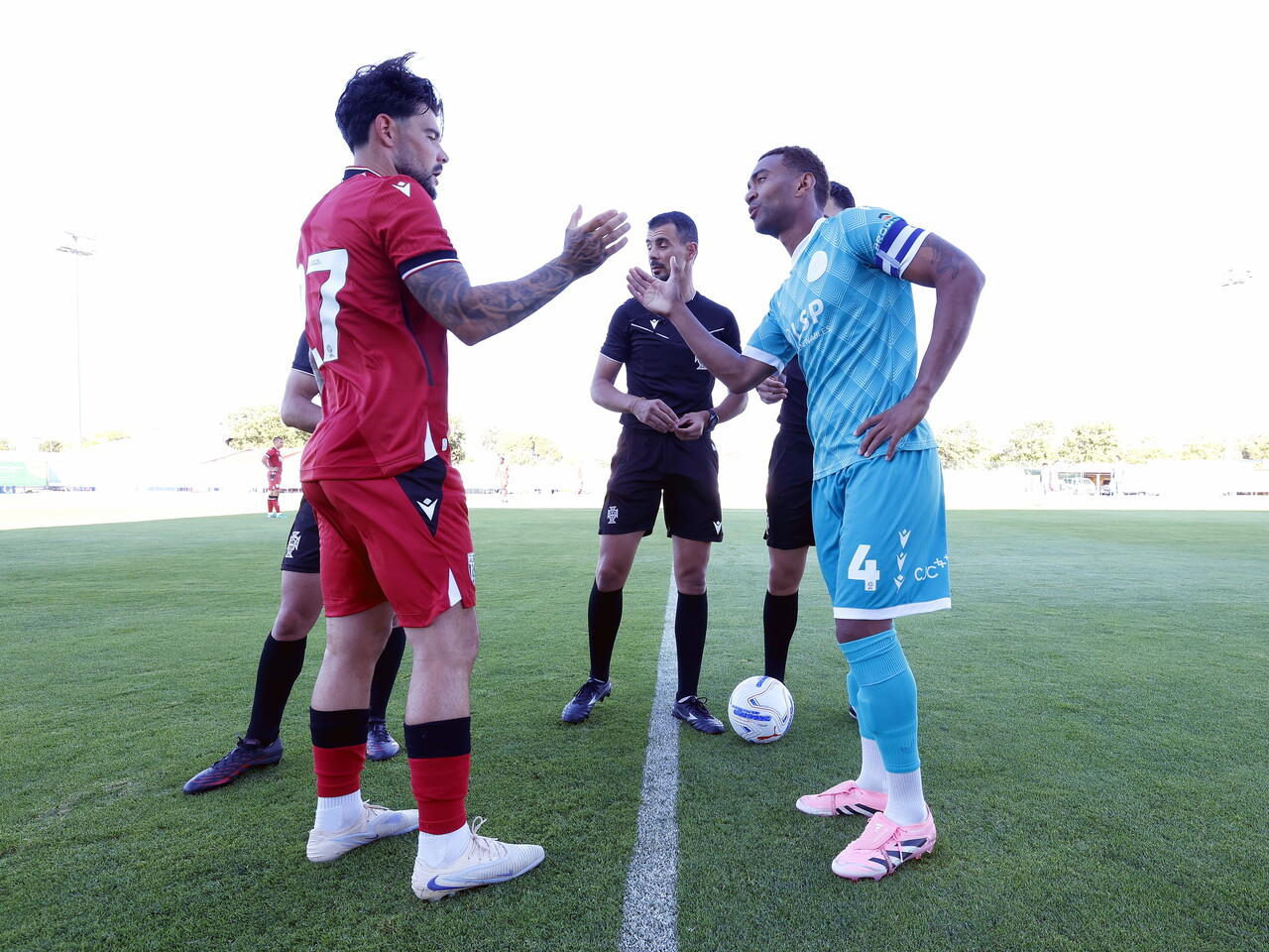Alex Mowatt shaking hands with the Bromley captain before the game