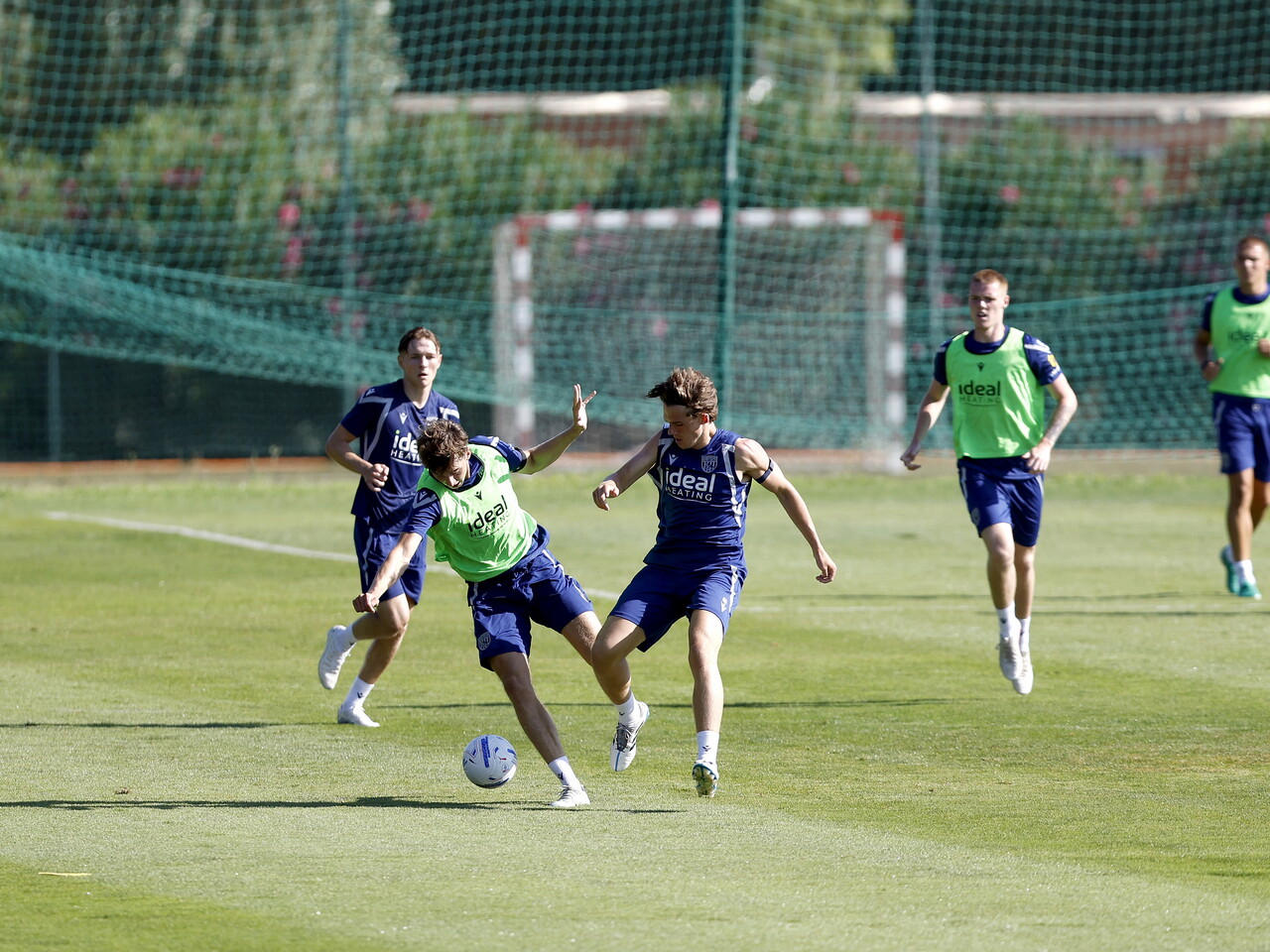 Harry Whitwell and Matty Crowther battle for the ball during a training session