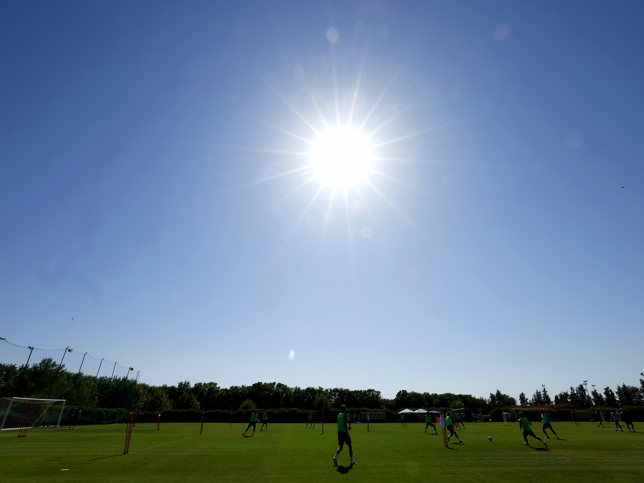 A general shot of training with the blue sky and sun up above 