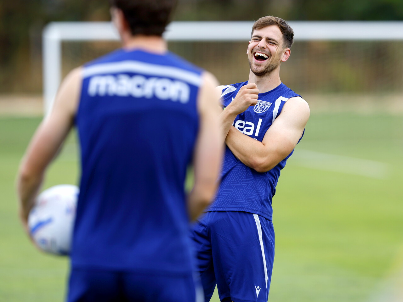 Jayson Molumby laughing during a training session