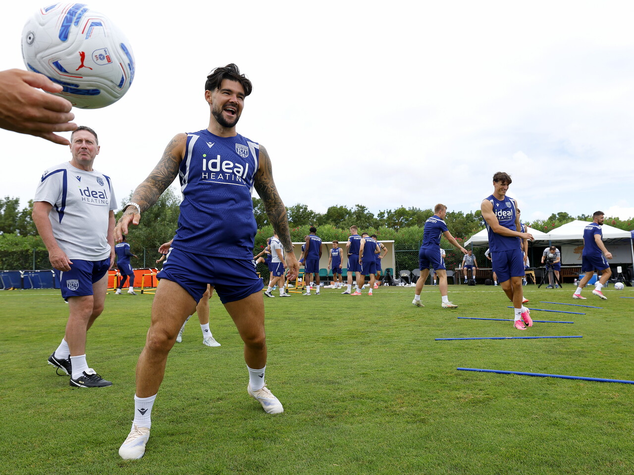 Alex Mowatt smiling during a training session