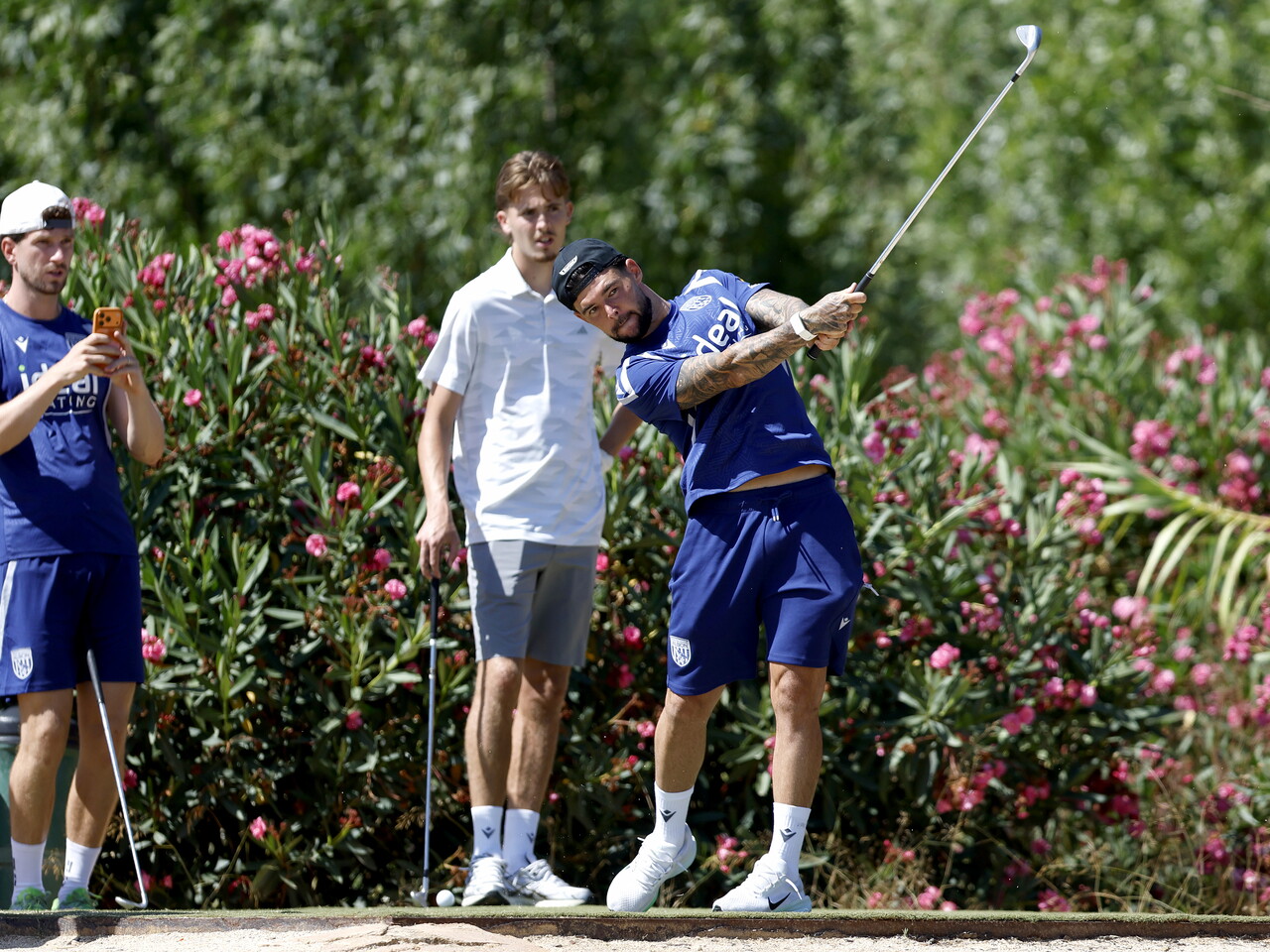Alex Mowatt hitting a golf shot 