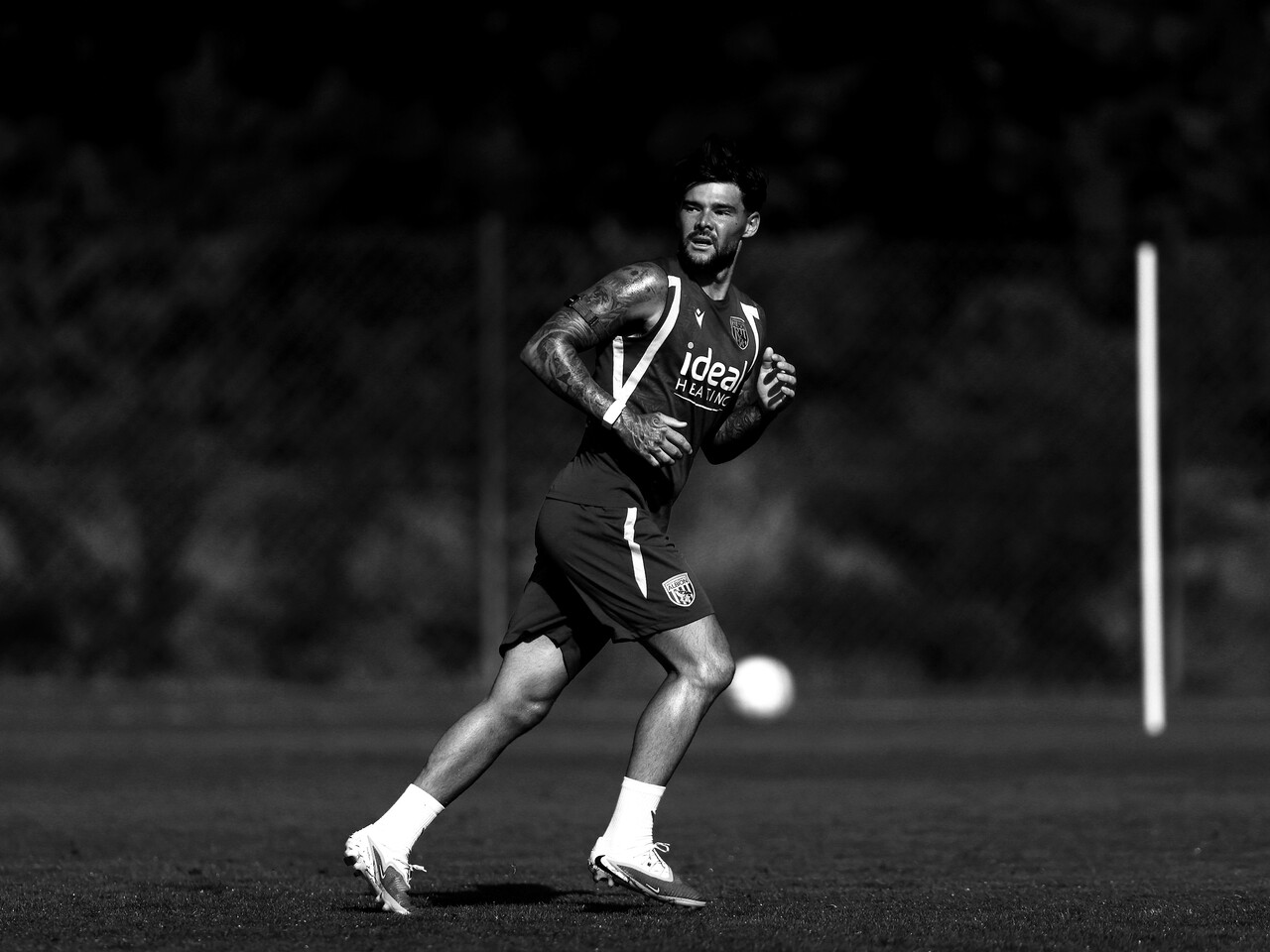 A black-and-white shot of Alex Mowatt in training 