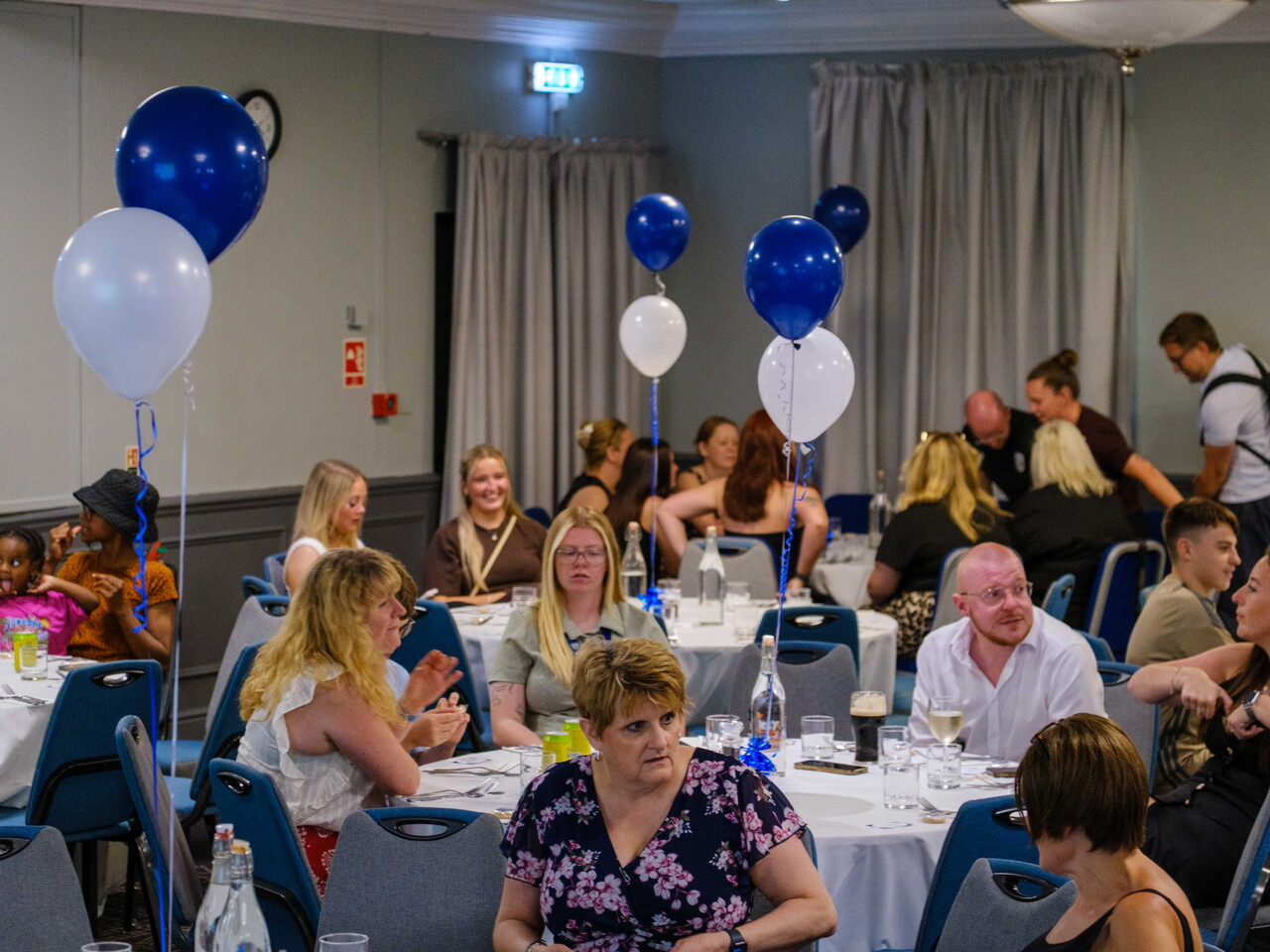 Guests seated at tables