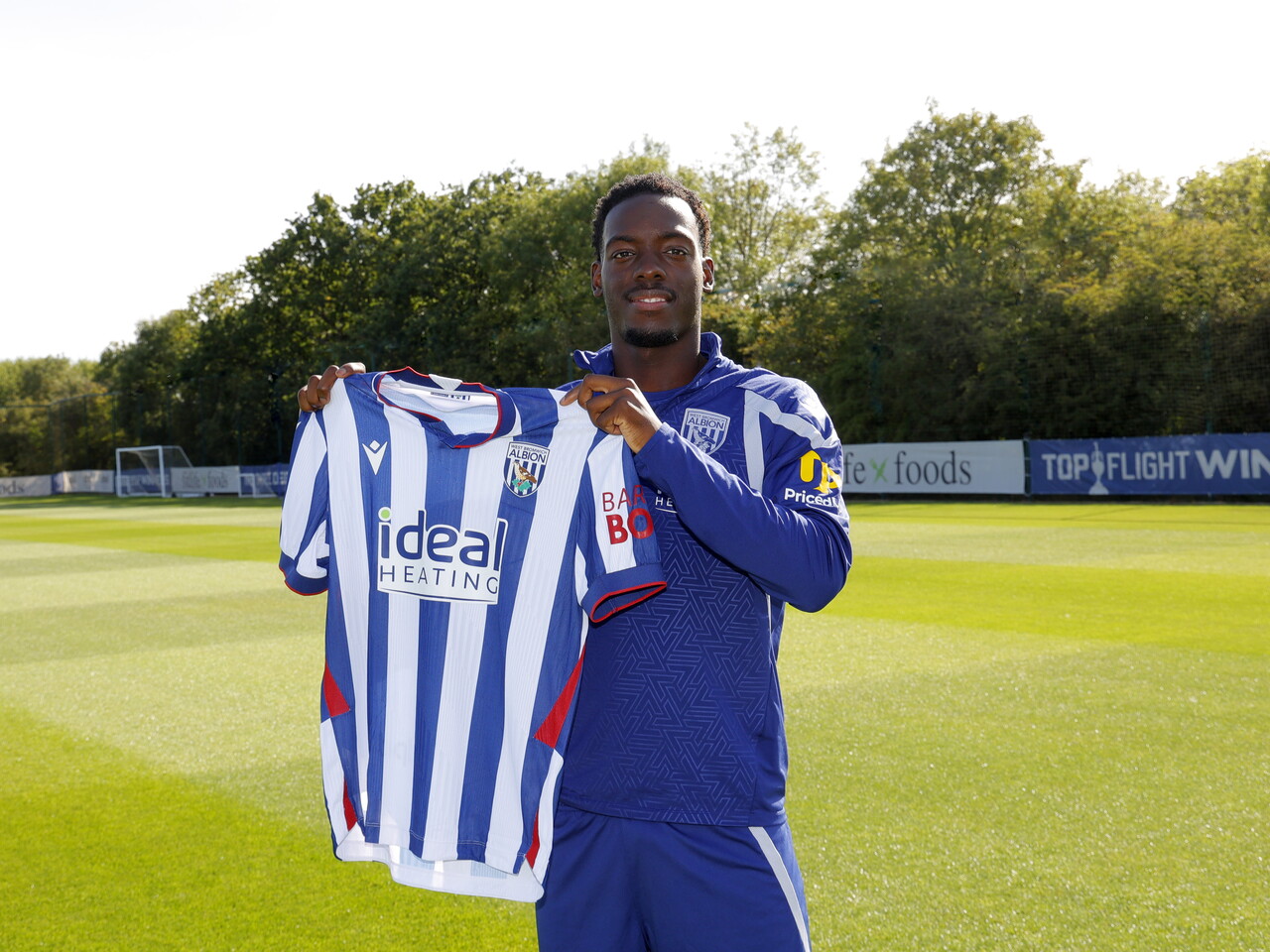 Rabby Nzingoula holds Albion's new home shirt