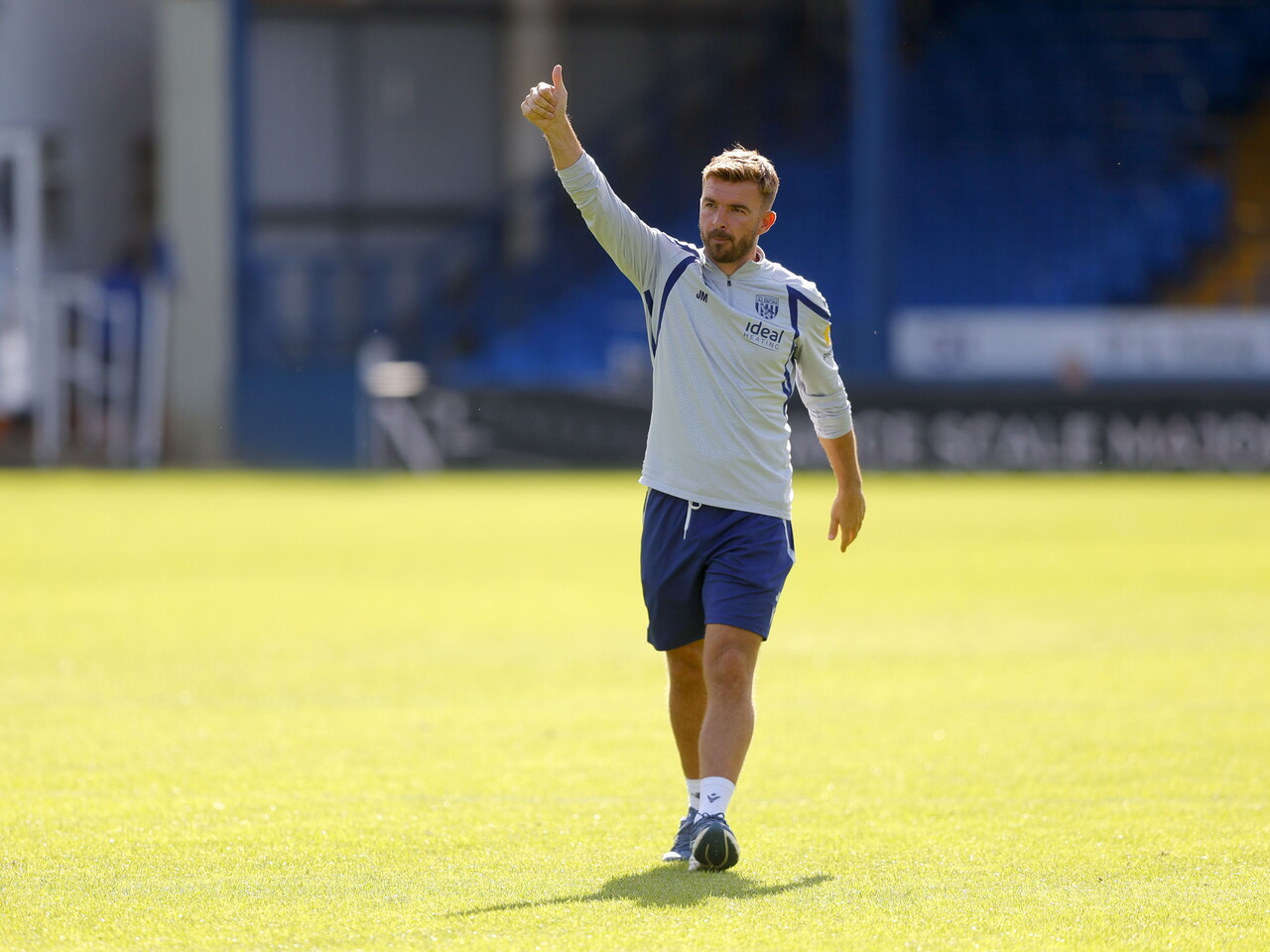 James Morrison waving to WBA fans at Peterborough 