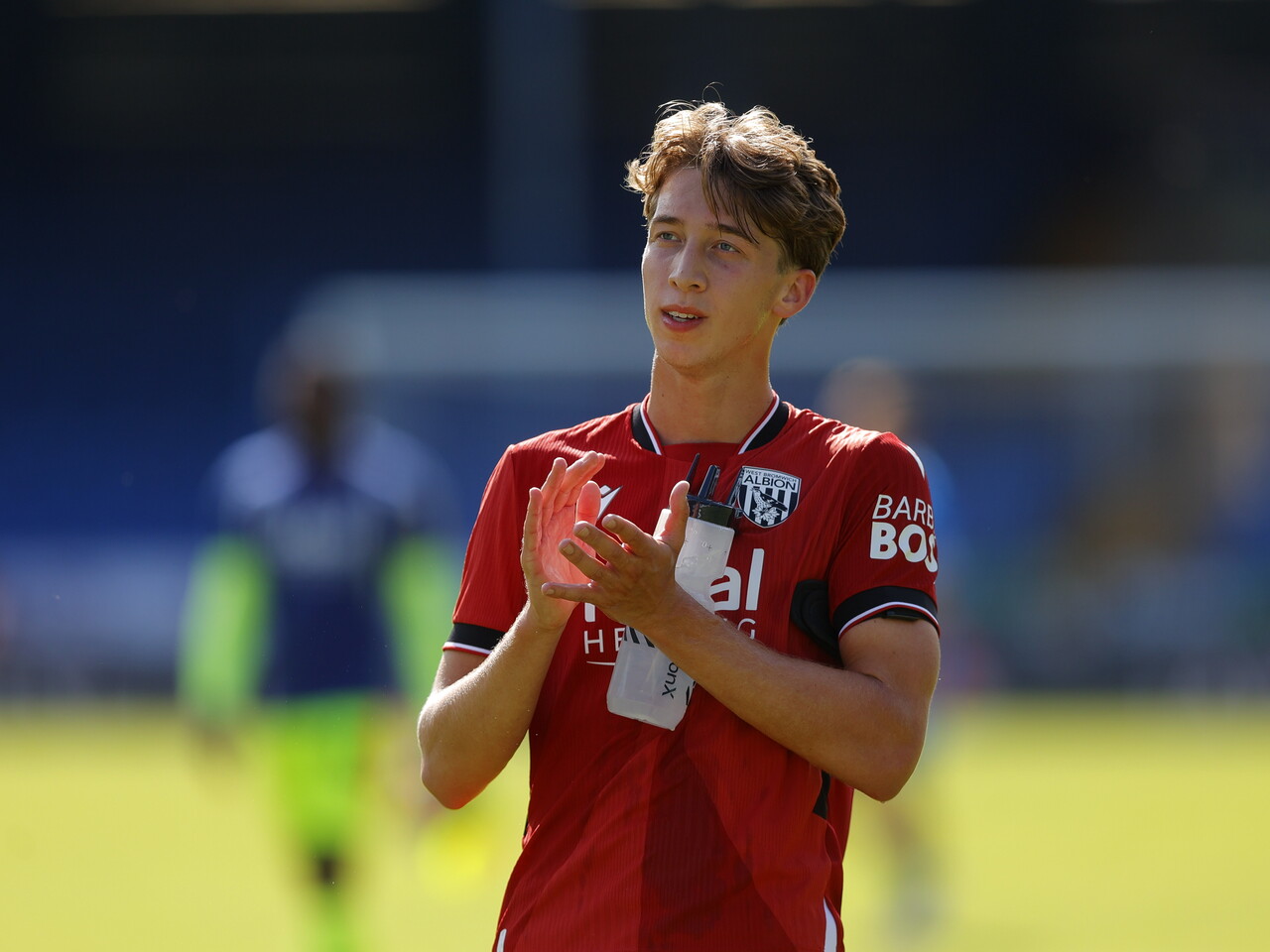 Harry Whitwell applauding WBA fans at Peterborough