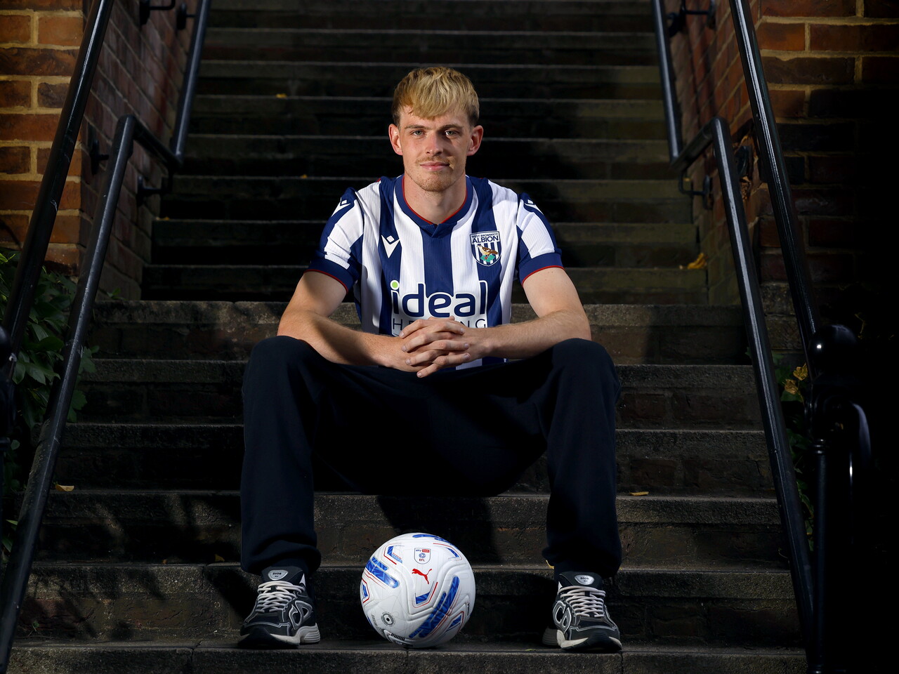 Toby Collyer poses with a ball in between his feet