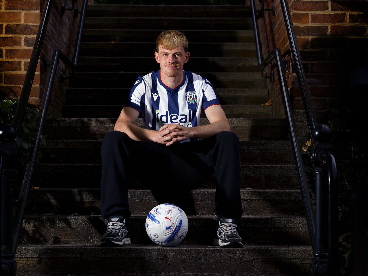 Toby Collyer poses with a ball in between his feet