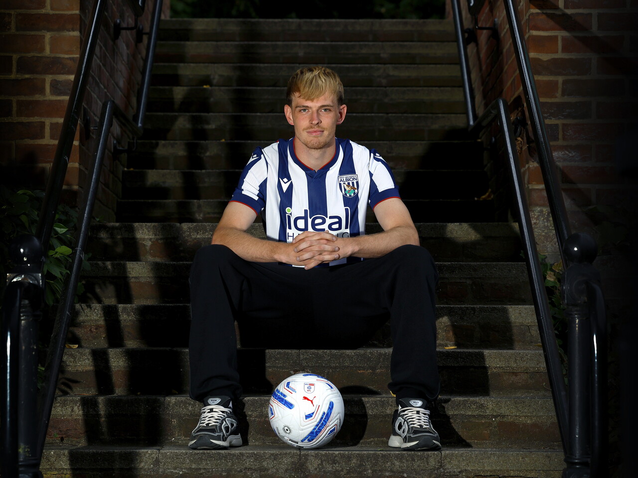Toby Collyer poses with a ball in between his feet
