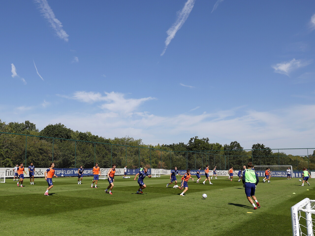 A general view of a training session with a bright blue sky above