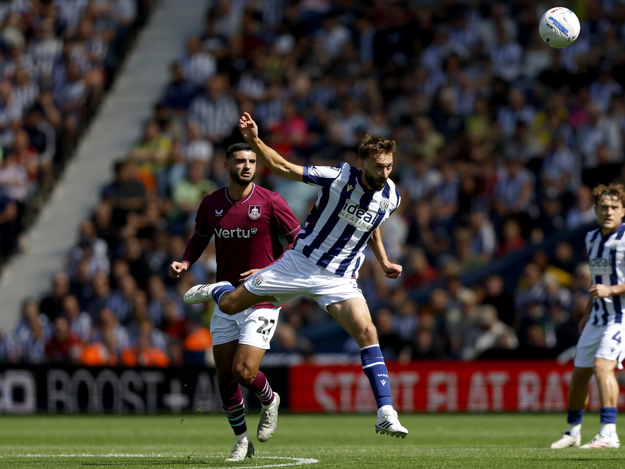 Nat Phillips heads the ball against Burnley
