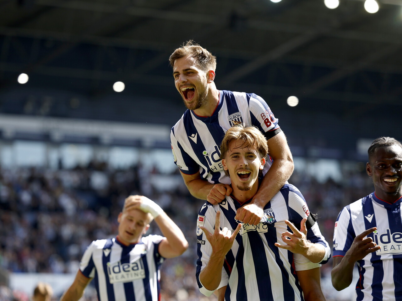 Isaac Price and Jayson Molumby celebrate the penalty goal