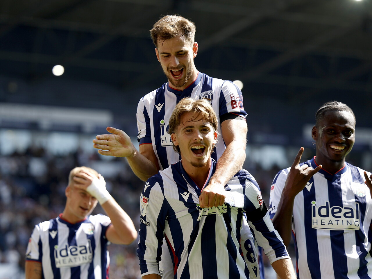 Isaac Price and Jayson Molumby celebrate the penalty goal