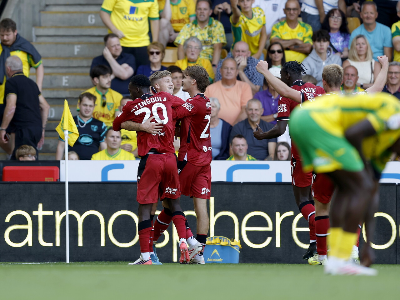 JJ Morgan celebrates his goal with Rabby Nzingoula and Isaac Price