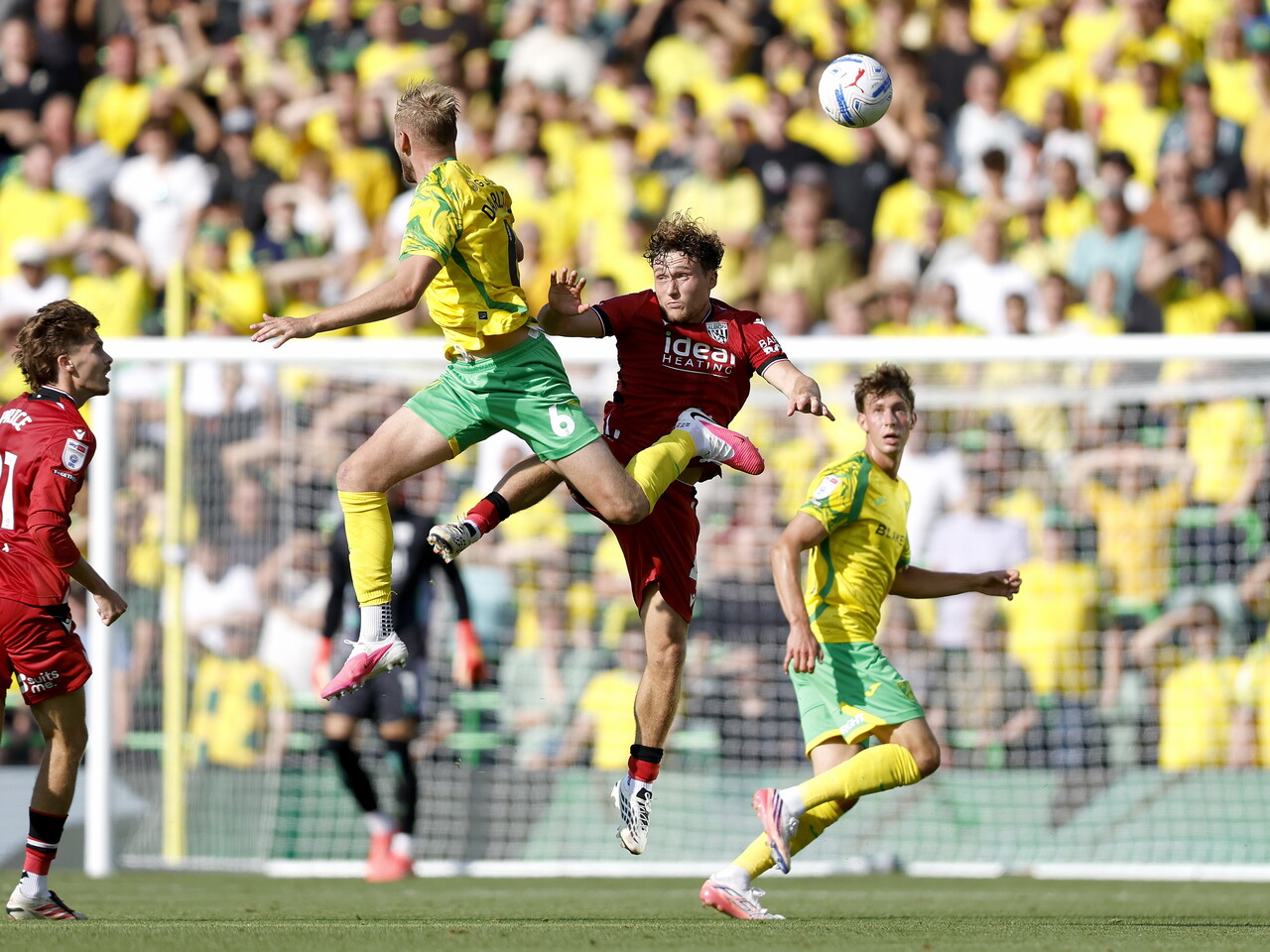 Callum Styles heads the ball against Norwich