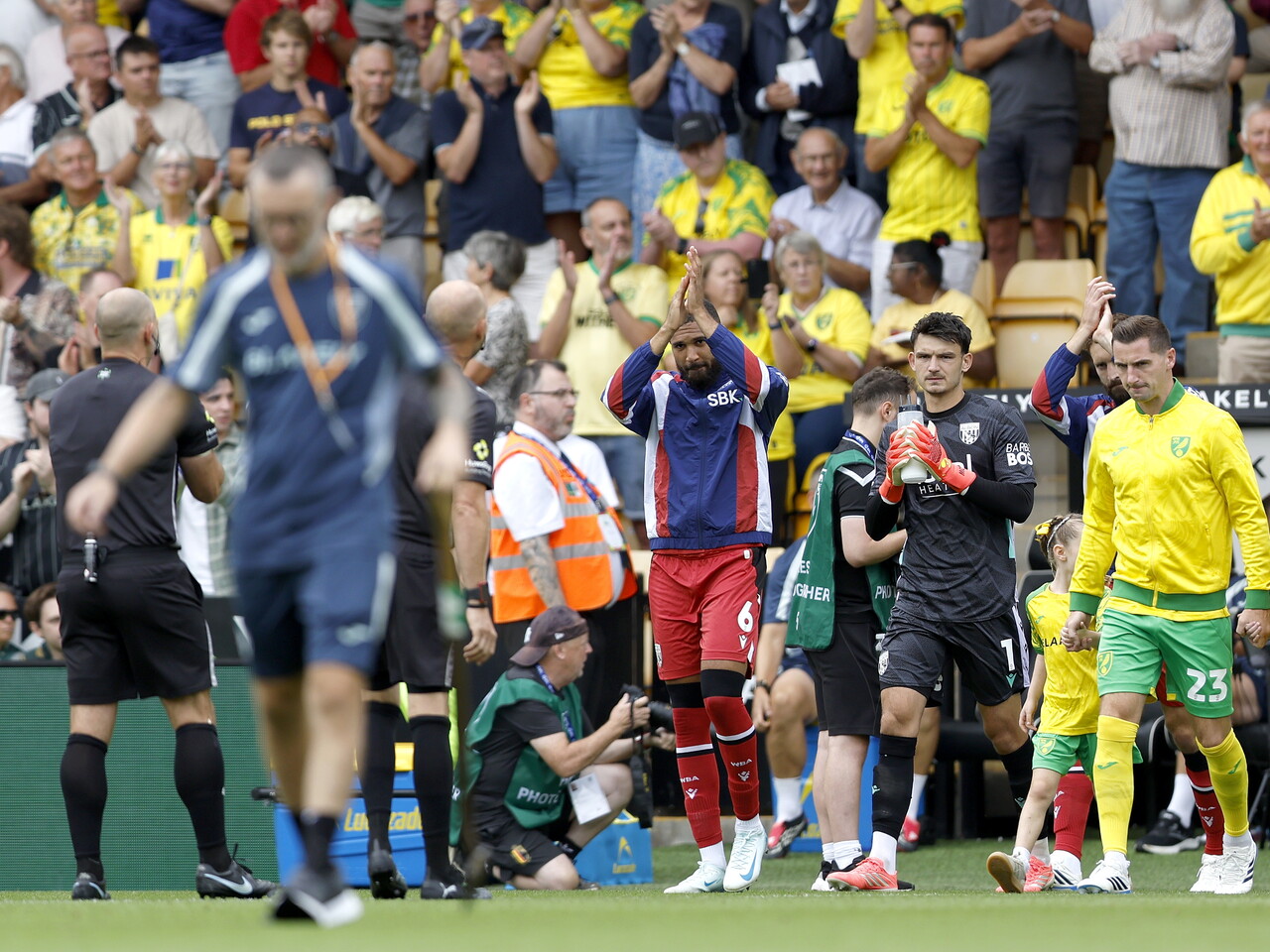 George Campbell leads the team out at Carrow Road