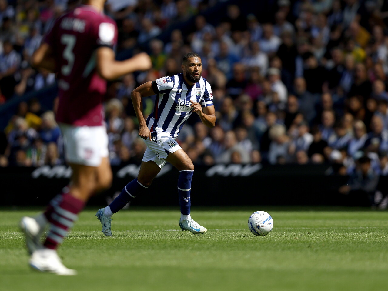 George Campbell on the ball against Burnley