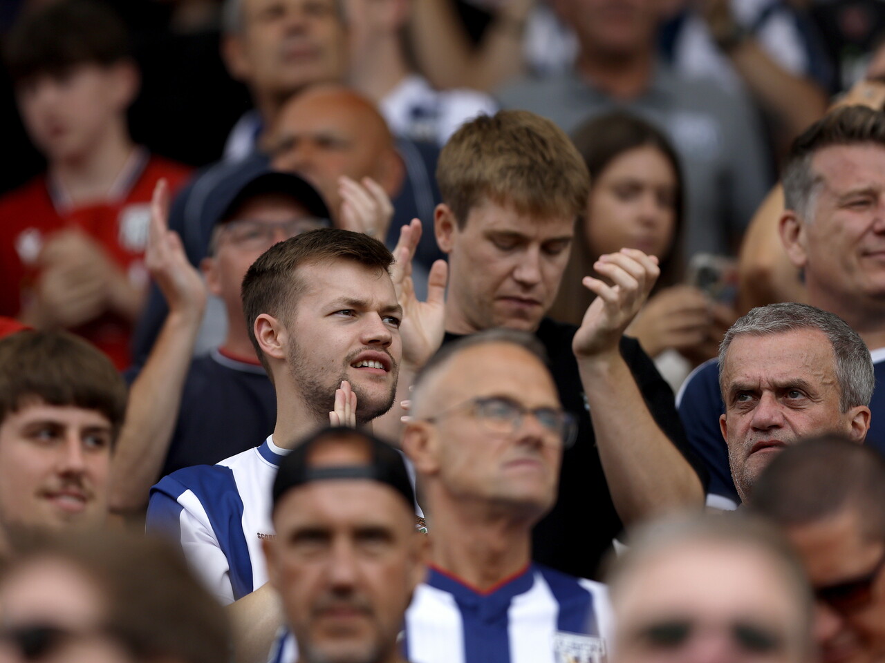 Albion fans celebrate at full-time.