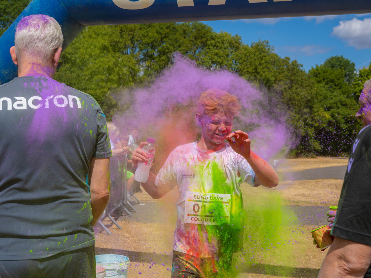 Participant covered in coloured powder during the colour run.