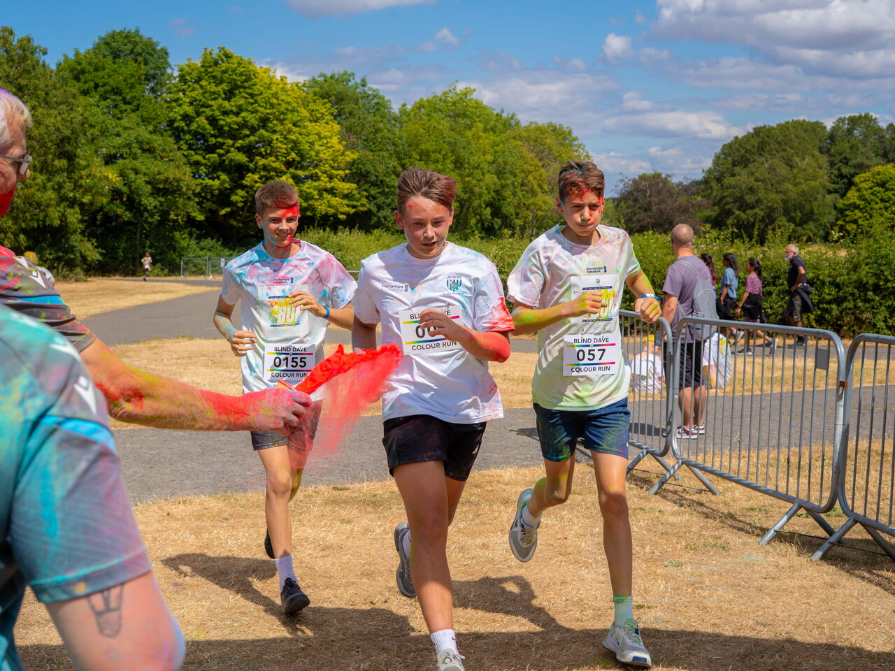 Participants running through the finish area.