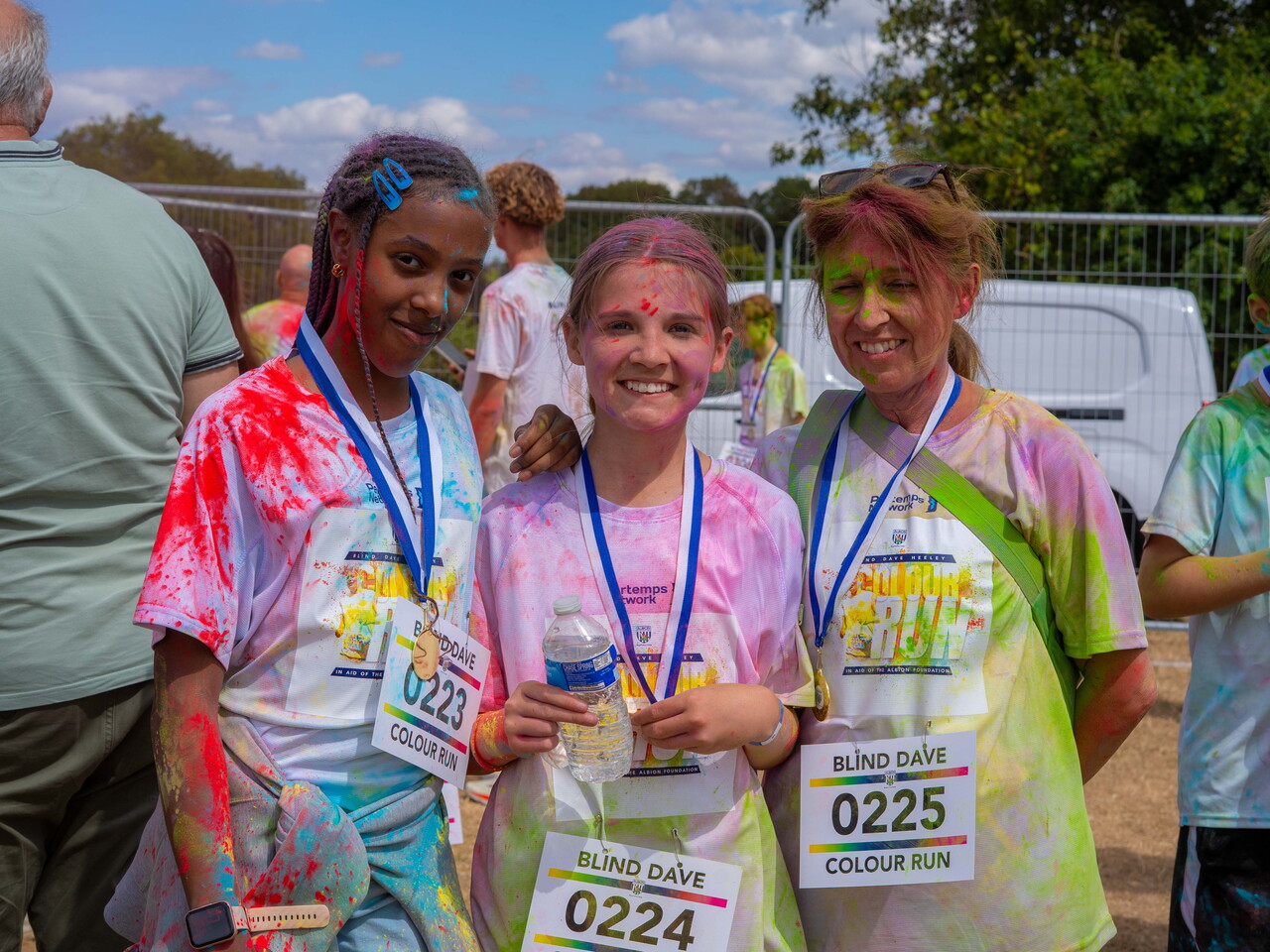 Participants posing for a photo after the Colour Run.