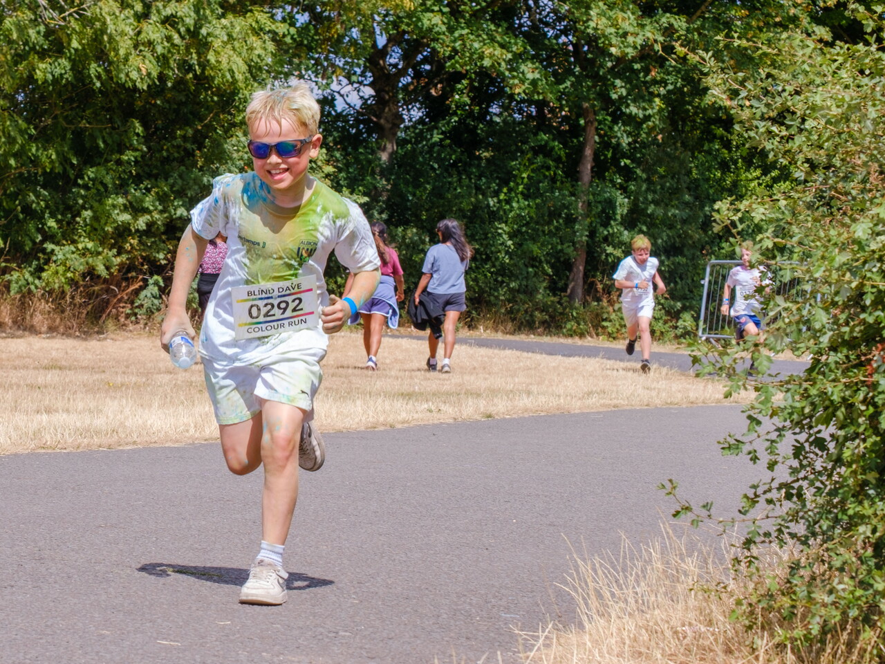 Participant running along the colour run route.