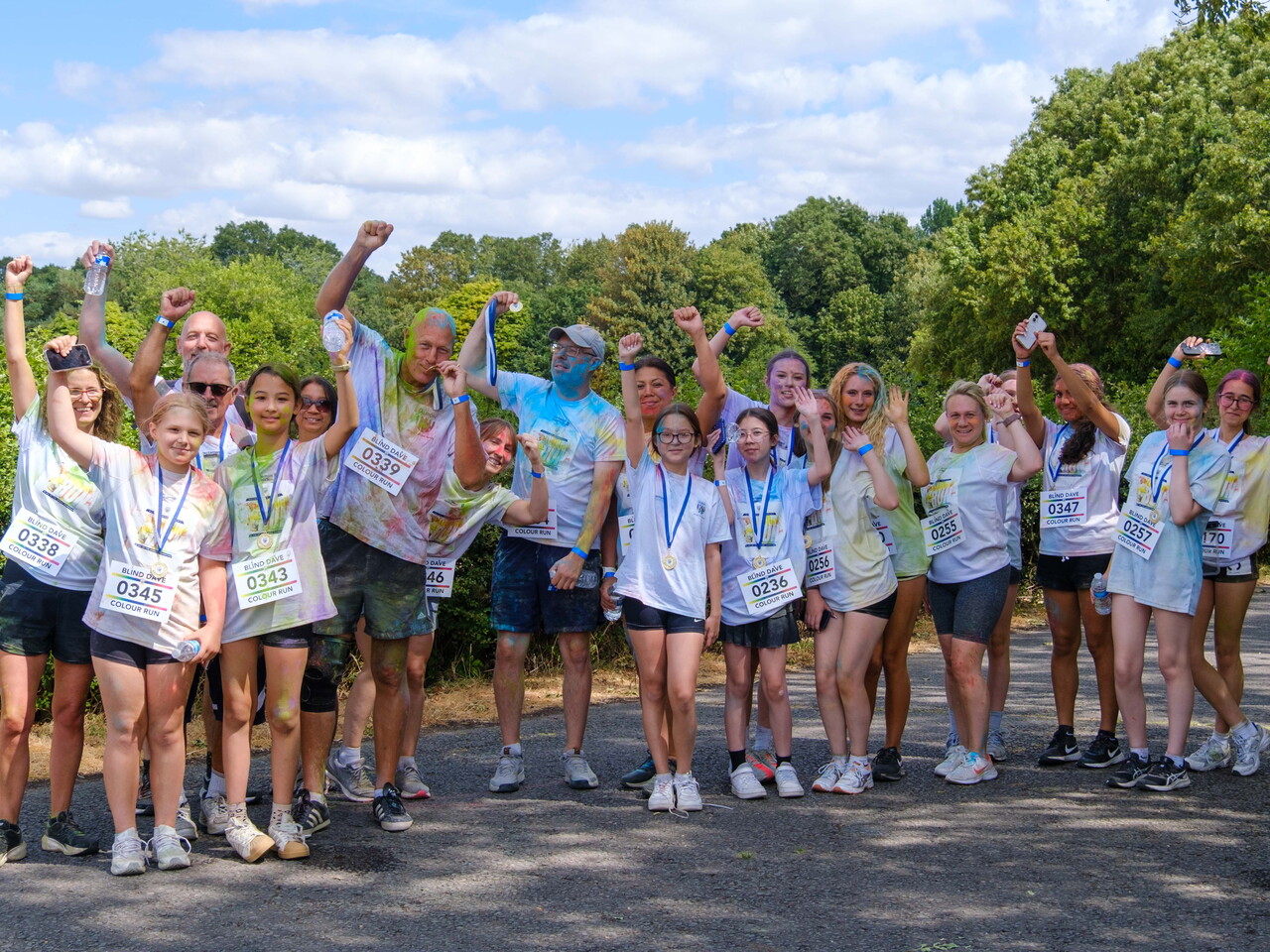 Group of participants posing for a photo after the Colour Run.