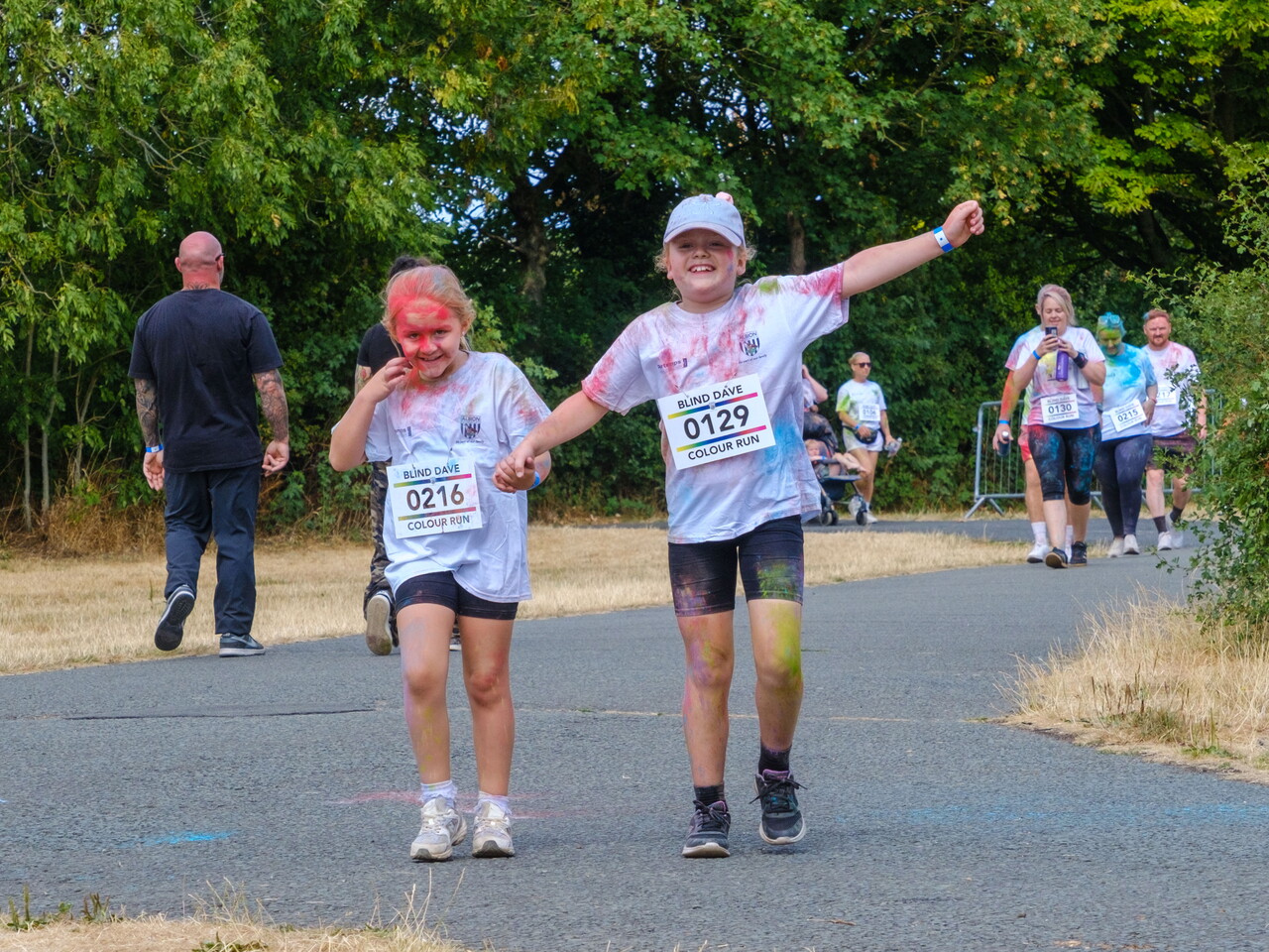Two participants crossing the finish area.