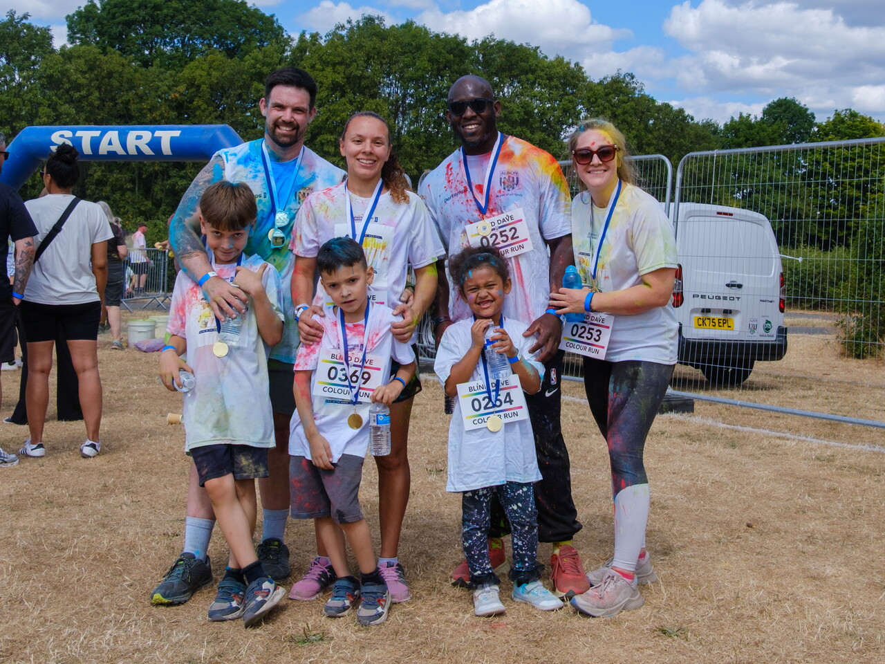 Participants posing for a photo after the Colour Run.