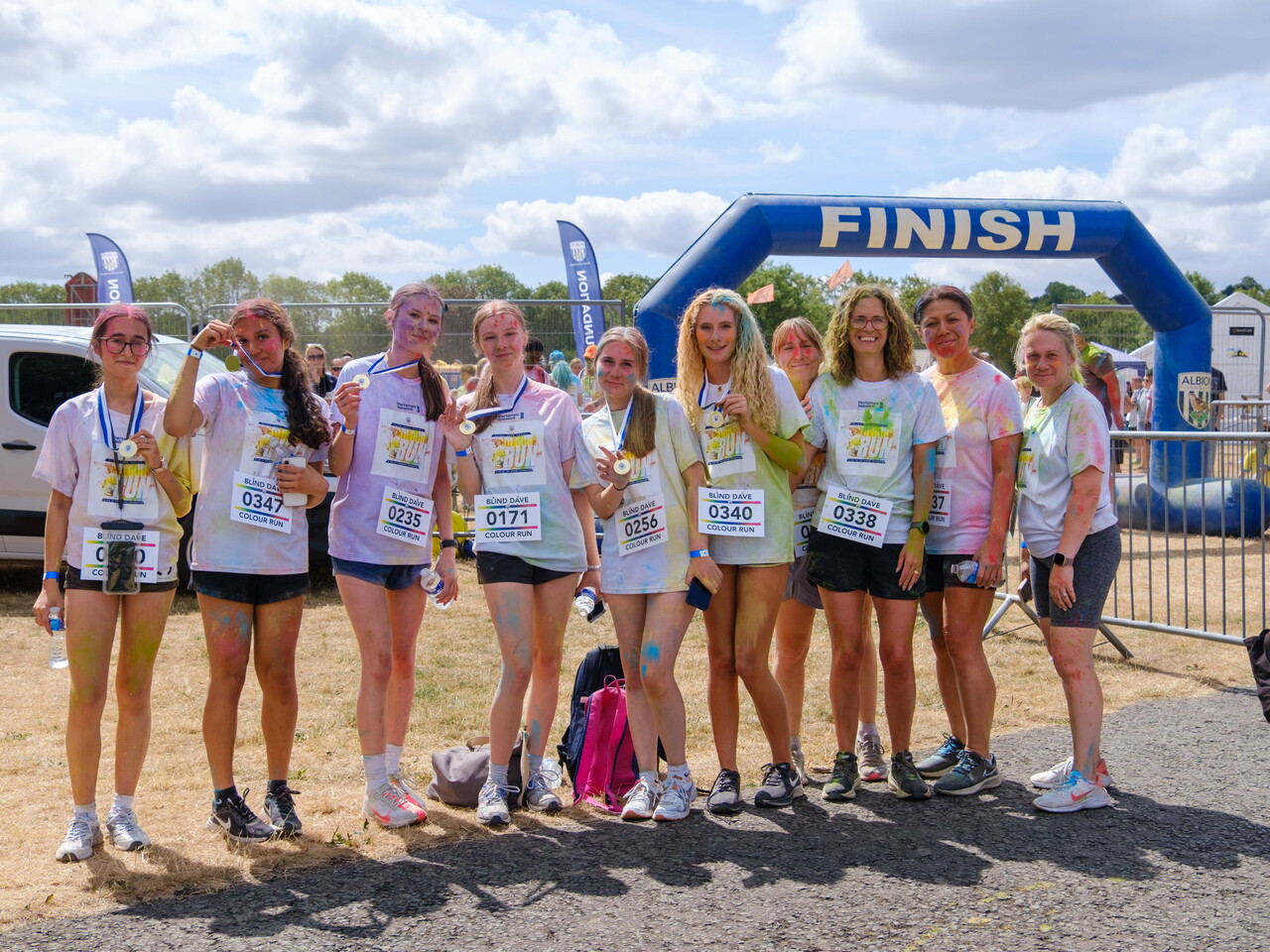 Group photo beneath the FINISH arch.