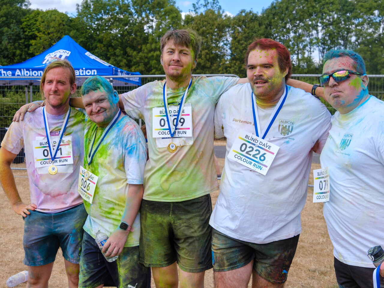 Participants posing for a photo after the Colour Run.