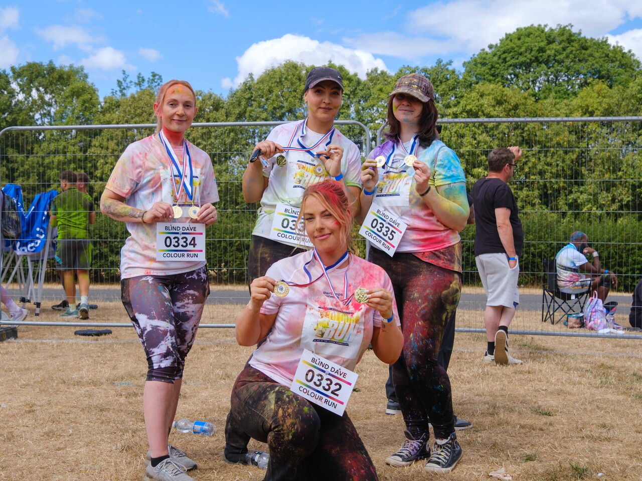 Group of participants posing with medals.