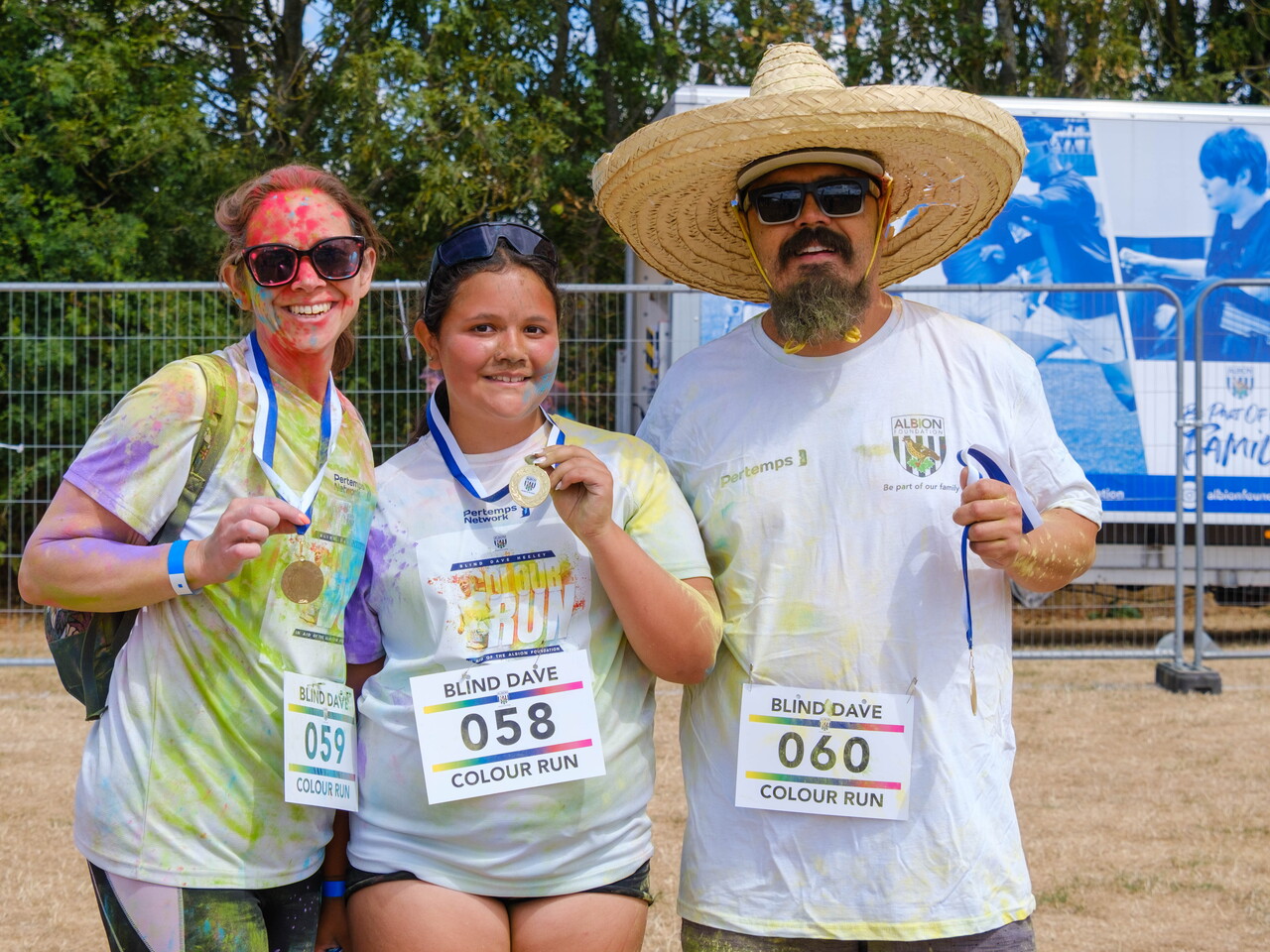 Participants posing for a photo after the Colour Run.