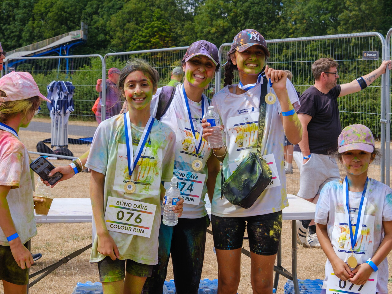 Group of posing for a photo next to the FINISH area.