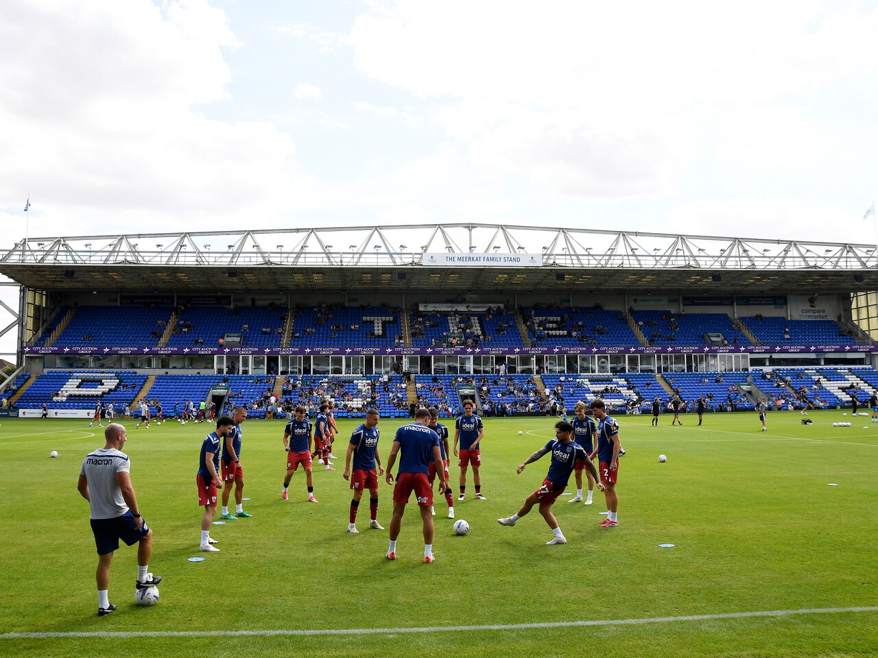 Albion players warming up before the Peterborough game
