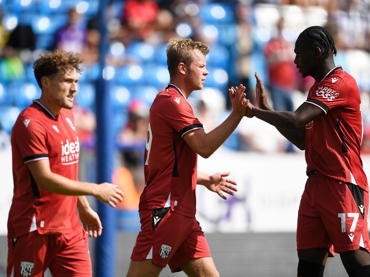 Aune Heggebø celebrates with Ousmane Diakité after his goal at Peterborough 