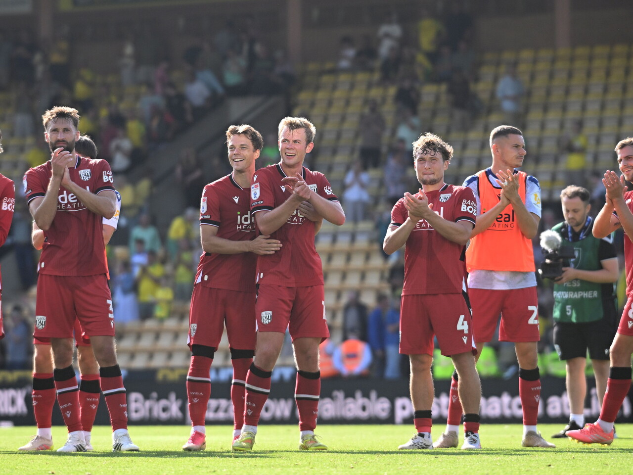 The squad applaud the fans at full-time.