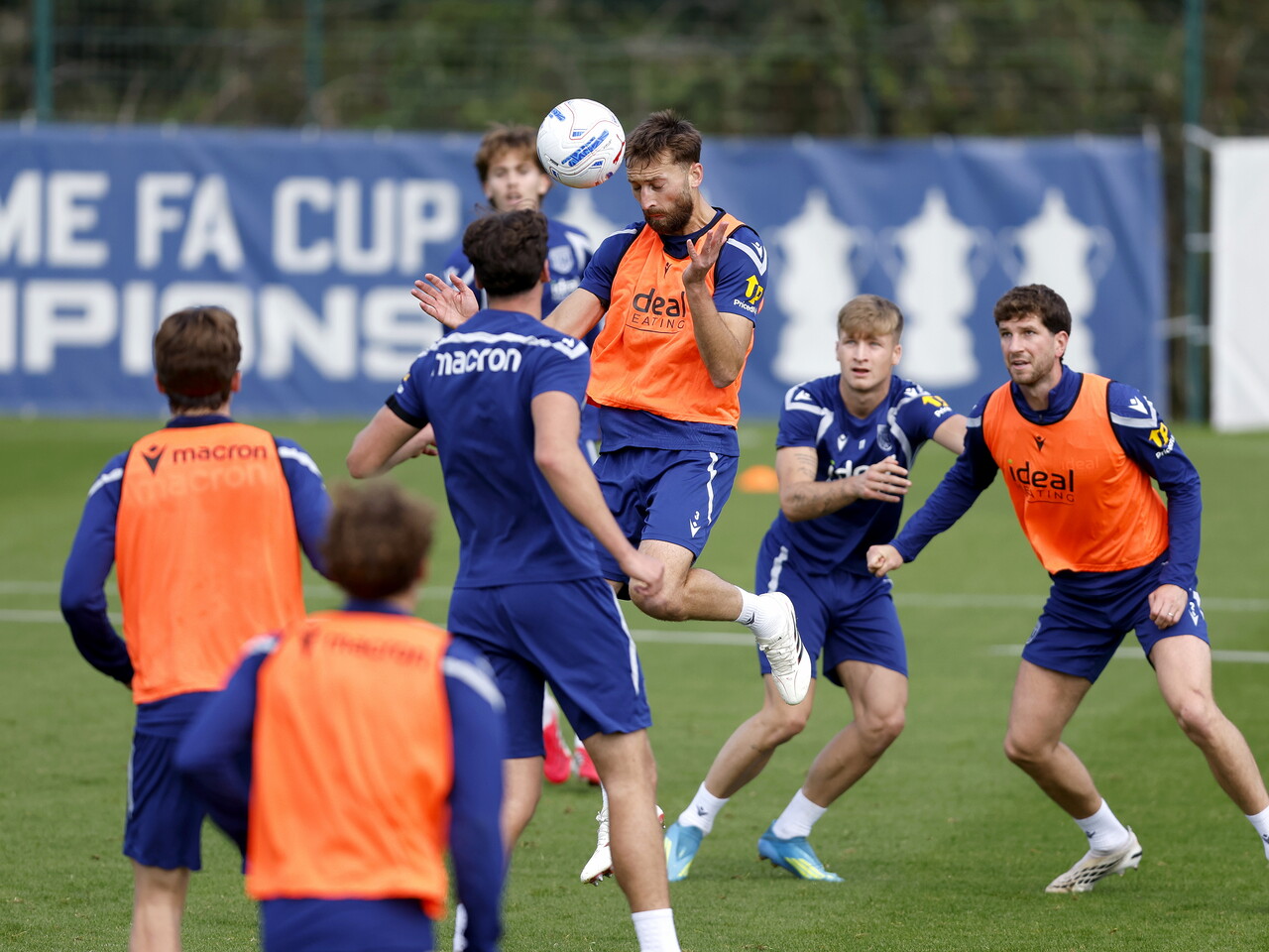 Nat Phillips heading the ball during a training session
